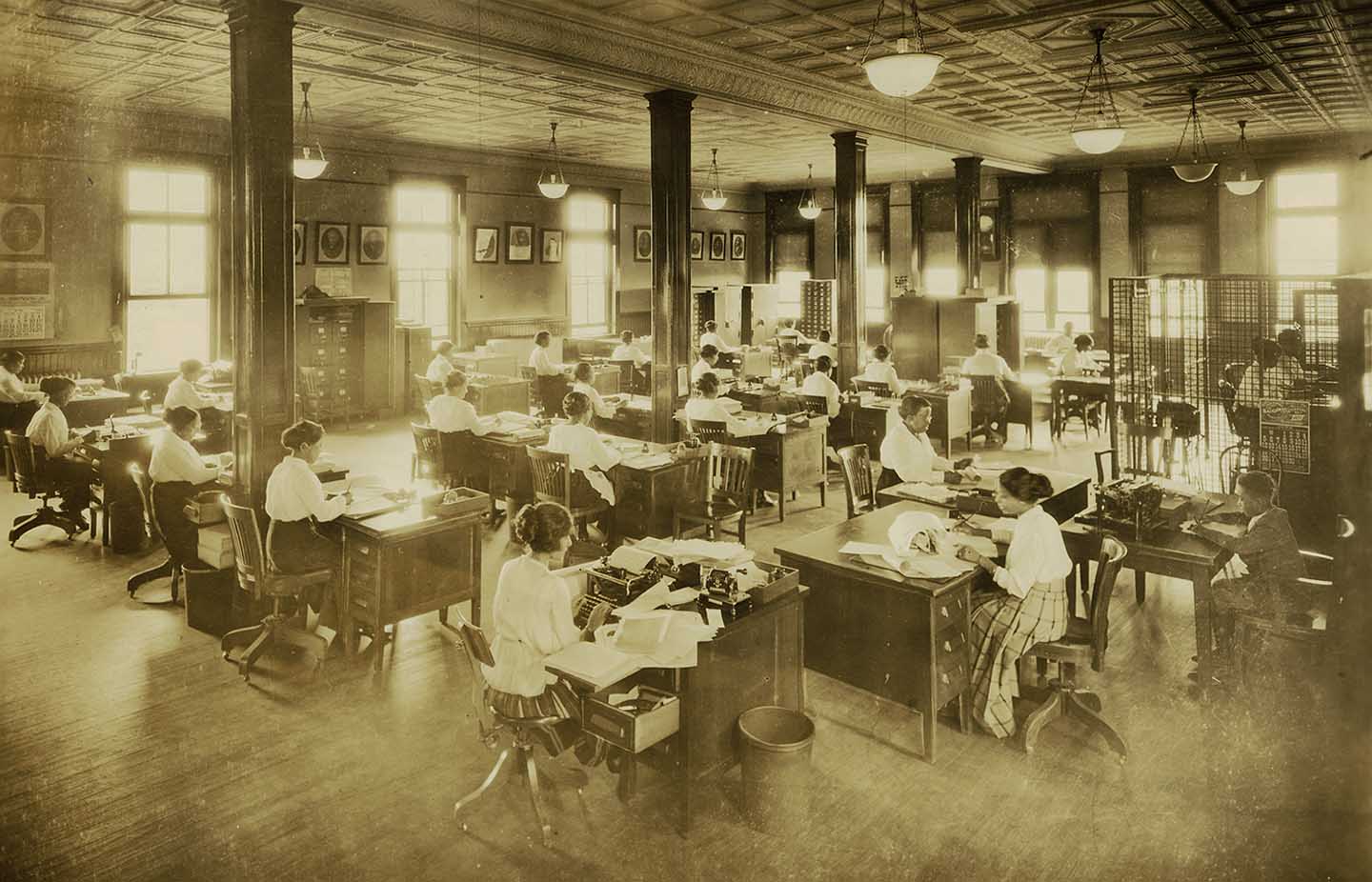 Sepiatone photo inside the office of St. Luke’s Emporium in 1903.