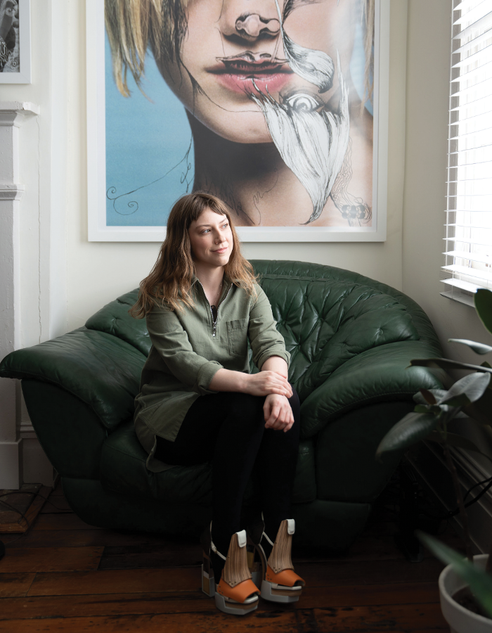 Alexandra Mitchell sits in a 1970s Italian leather chair in her Shockoe Bottom house.