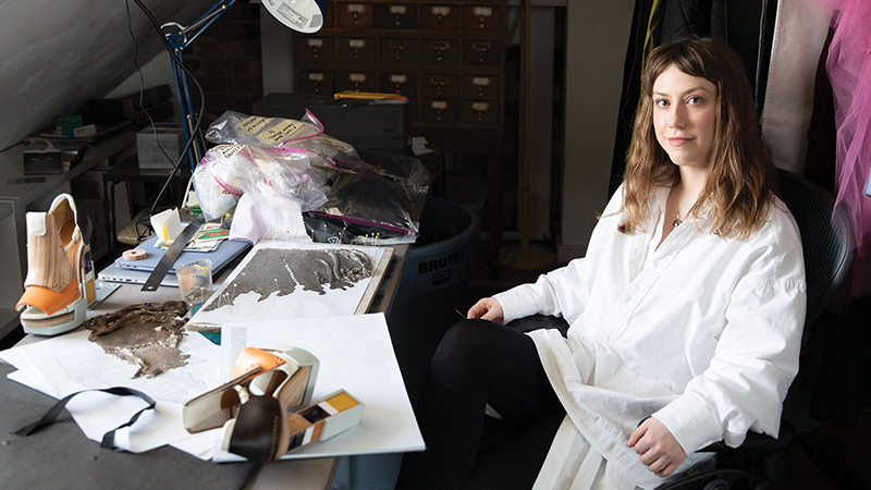 Alexandra Mitchell sitting down at her desk