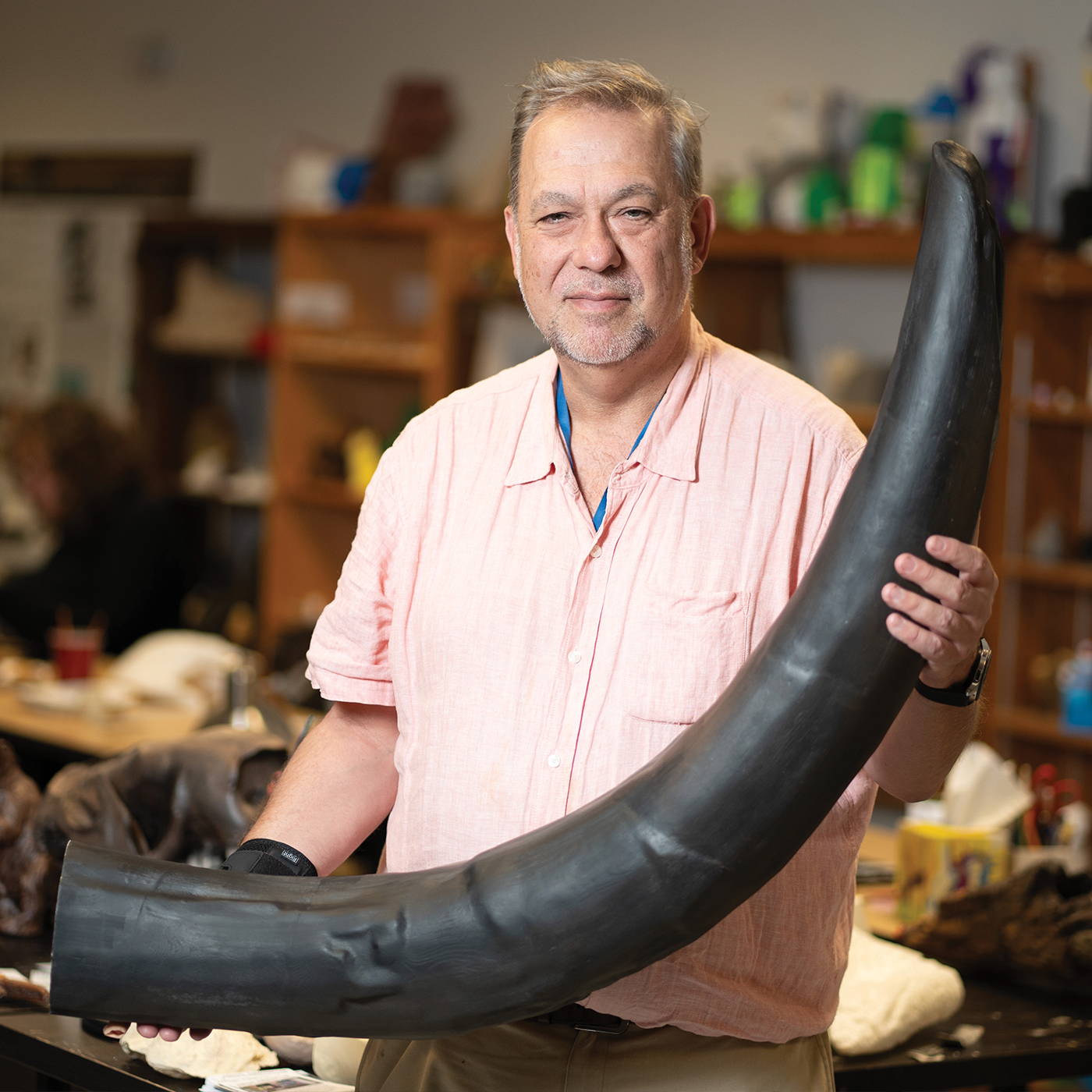 Bernard Means holding a mastodon tusk