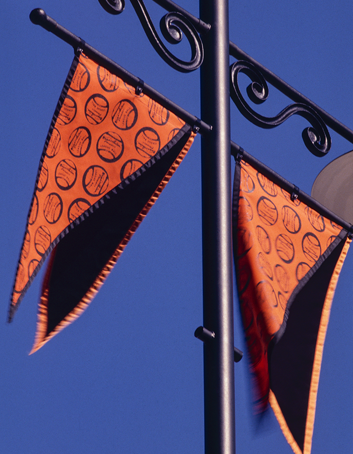 a set of orange flags outside Oriole Park at Camden Yards