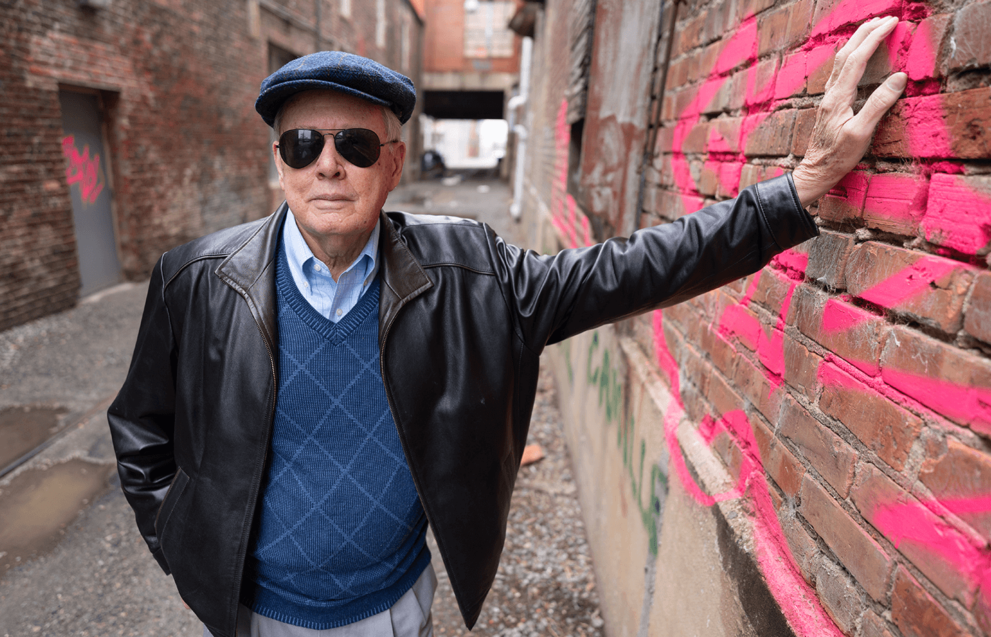 Howard Owen standing in an alley