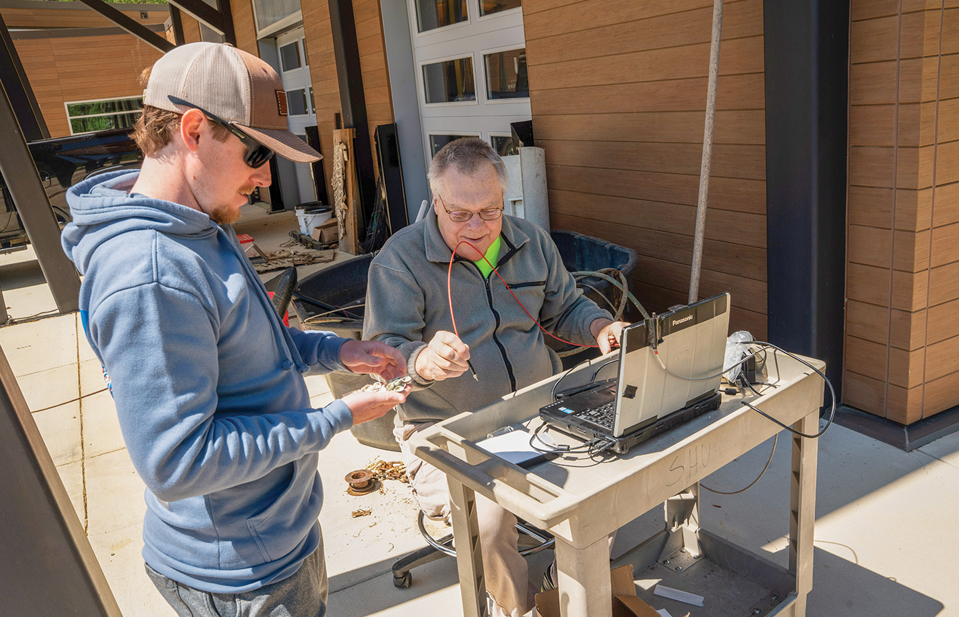 Fisheries technician Brycen Boettcher, (left) and researcher Paul Zimba, Ph.D.